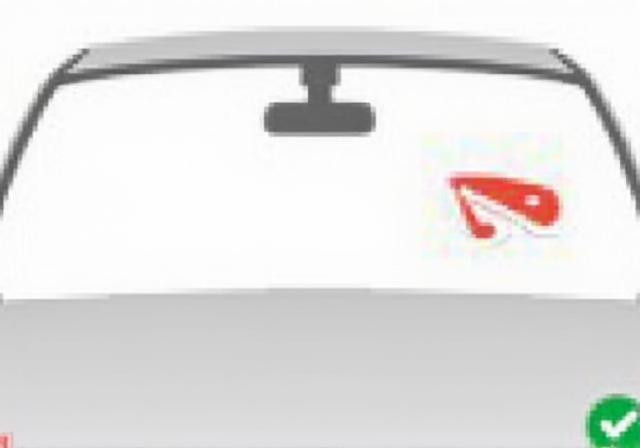 An illustration showing the correct placement of the vignette on a windshield.